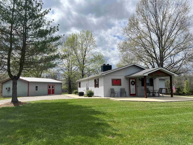 18065 Buzzard Roost Rd, Magnet, IN 47520 - view of front facade with a chimney and a front lawn
