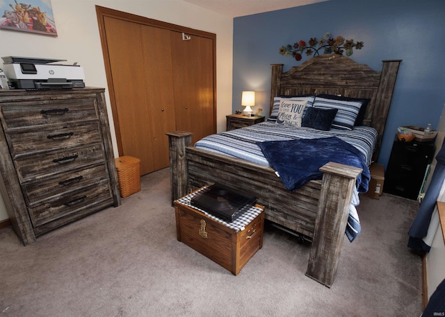 carpeted bedroom with a closet