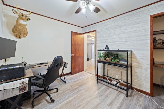 home office featuring a ceiling fan, wood finished floors, crown molding, and baseboards