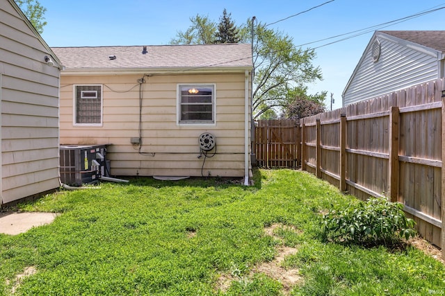 view of yard featuring central air condition unit