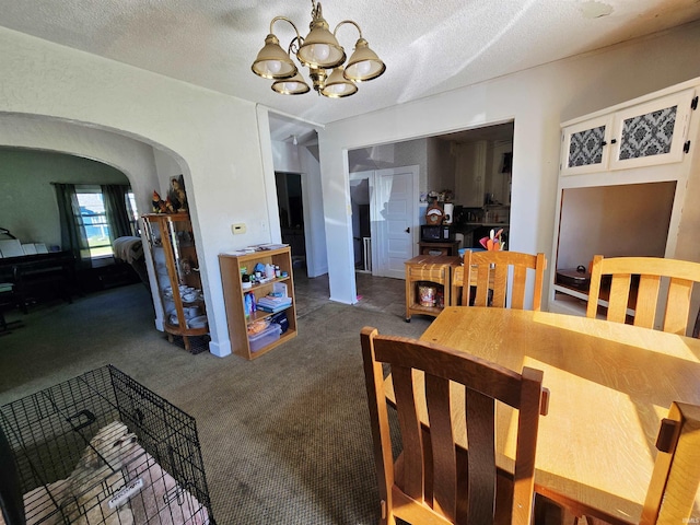130 W 2nd St, Rochester, IN 46975 - carpeted dining area with arched walkways, a chandelier, and a textured ceiling