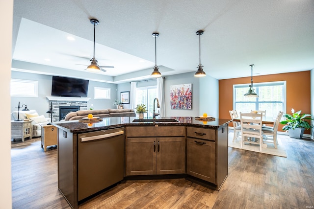 13865 Escondida Cv, Fort Wayne, IN 46845 - kitchen with stainless steel dishwasher, a sink, dark wood finished floors, dark stone counters, and recessed lighting