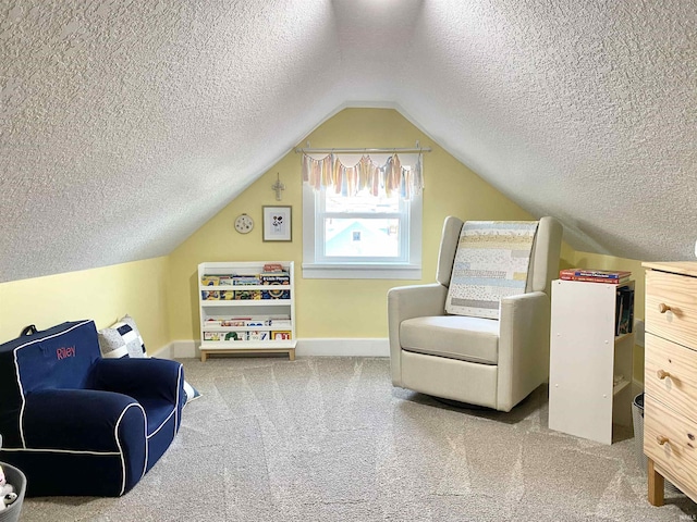 bonus room featuring a textured ceiling, carpet flooring, baseboards, and lofted ceiling