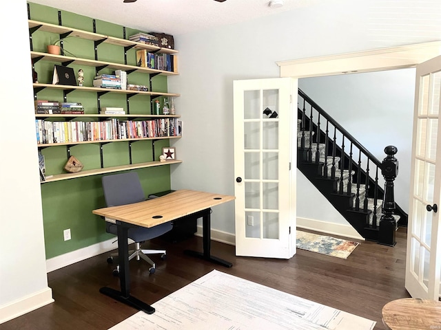 home office featuring french doors, baseboards, and wood finished floors