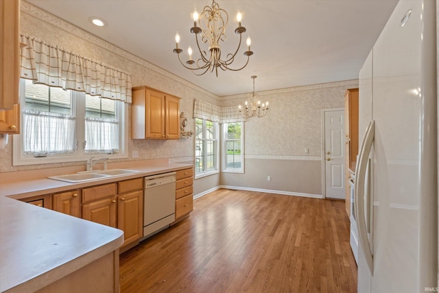3821 Emerald Bay St, Mishawaka, IN 46545 - kitchen featuring white appliances, a chandelier, a sink, light wood-type flooring, and wallpapered walls