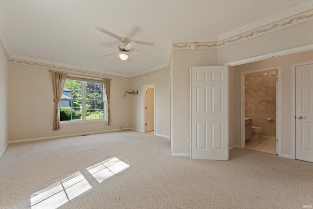 3821 Emerald Bay St, Mishawaka, IN 46545 - unfurnished bedroom featuring carpet flooring, ornamental molding, baseboards, connected bathroom, and a ceiling fan