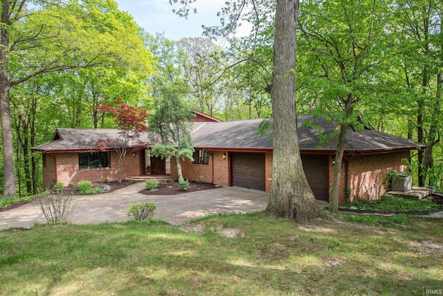 view of front facade featuring driveway, an attached garage, brick siding, and roof with shingles