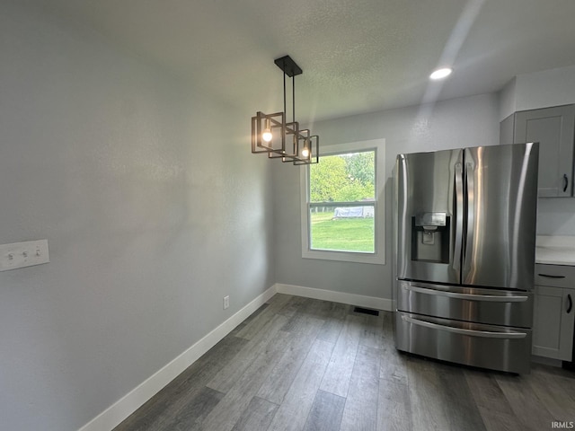 916 2nd Ave, Jasper, IN 47546 - kitchen with stainless steel fridge, a chandelier, gray cabinets, baseboards, and dark wood-type flooring