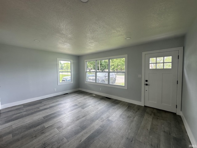 916 2nd Ave, Jasper, IN 47546 - foyer featuring a textured ceiling, dark wood-style floors, and baseboards