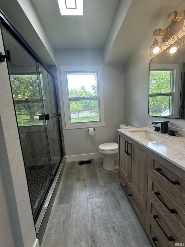 916 2nd Ave, Jasper, IN 47546 - bathroom featuring plenty of natural light, a shower stall, vanity, and toilet