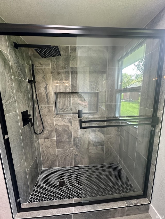 916 2nd Ave, Jasper, IN 47546 - full bathroom featuring a stall shower and a textured ceiling