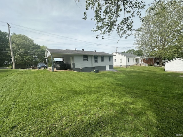 916 2nd Ave, Jasper, IN 47546 - rear view of house featuring a yard and central AC unit