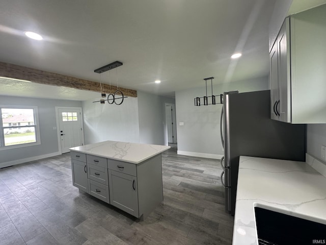 916 2nd Ave, Jasper, IN 47546 - kitchen with gray cabinetry, baseboards, hanging light fixtures, light stone countertops, and recessed lighting