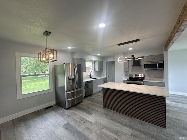 916 2nd Ave, Jasper, IN 47546 - kitchen with stainless steel appliances, gray cabinetry, wall chimney exhaust hood, baseboards, and recessed lighting