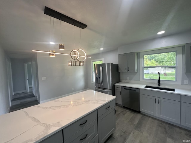 916 2nd Ave, Jasper, IN 47546 - kitchen featuring appliances with stainless steel finishes, a sink, gray cabinets, wood finished floors, and recessed lighting