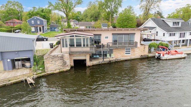 dock area with a residential view and a deck with water view