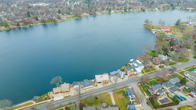 view of property location with a large body of water and nearby suburban area