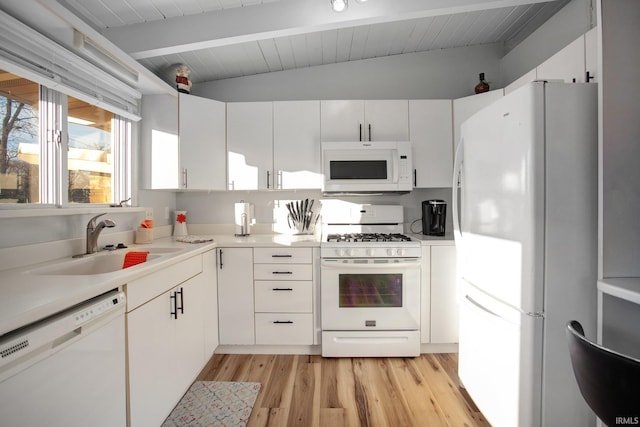 kitchen featuring white appliances, a sink, light wood-style floors, light countertops, and white cabinets