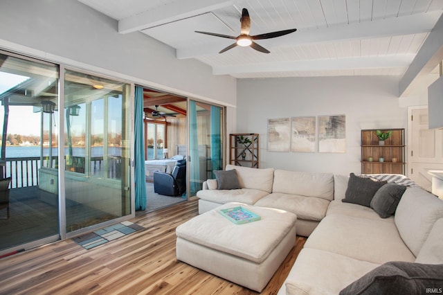 living room with a ceiling fan, wood finished floors, and wood ceiling