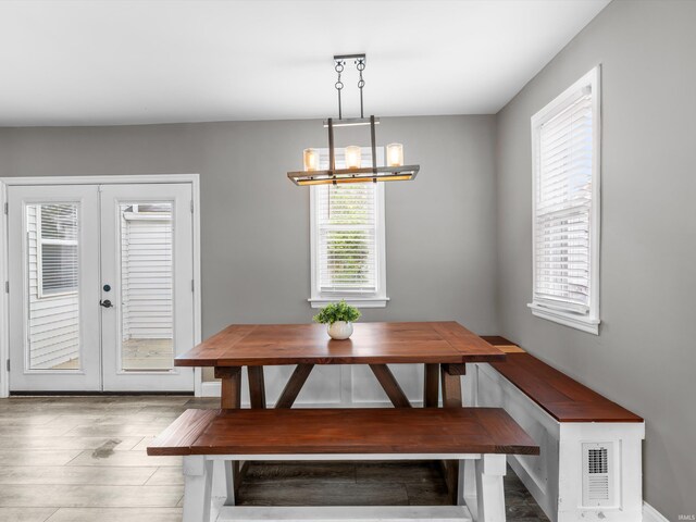 541 S Kelsey Ave, Evansville, IN 47714 - dining area featuring breakfast area, french doors, a chandelier, and wood finished floors