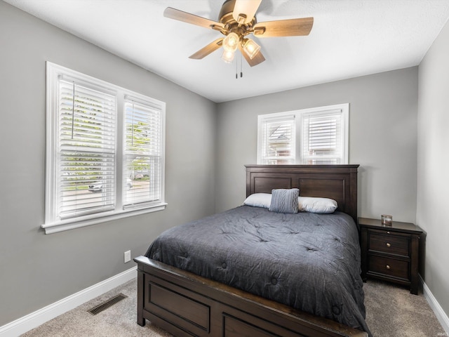 541 S Kelsey Ave, Evansville, IN 47714 - bedroom with carpet, baseboards, and ceiling fan