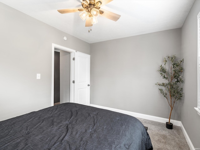 541 S Kelsey Ave, Evansville, IN 47714 - carpeted bedroom with baseboards and a ceiling fan