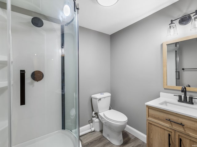 541 S Kelsey Ave, Evansville, IN 47714 - full bath featuring a shower stall, wood finished floors, baseboards, and toilet