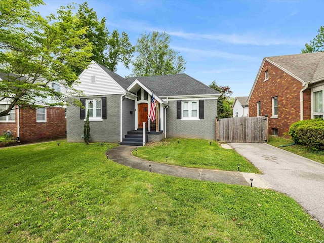 541 S Kelsey Ave, Evansville, IN 47714 - view of front facade featuring asphalt driveway and brick siding