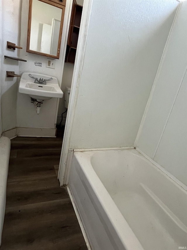 115 E 2nd St, Peru, IN 46970 - full bathroom featuring a bath and wood finished floors
