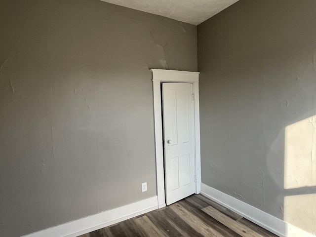 115 E 2nd St, Peru, IN 46970 - unfurnished room featuring dark wood-type flooring and baseboards