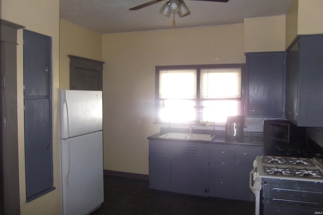 kitchen featuring white appliances, a ceiling fan, and a sink