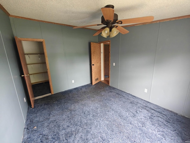 78 Ems B6 Ln, Leesburg, IN 46538 - empty room with ceiling fan, a textured ceiling, carpet floors, and a decorative wall