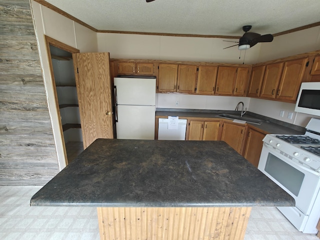 78 Ems B6 Ln, Leesburg, IN 46538 - kitchen featuring white appliances, light flooring, a sink, ceiling fan, and brown cabinets