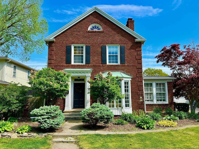 1700 W Taylor St, Kokomo, IN 46901 - view of front of home featuring a chimney and brick siding