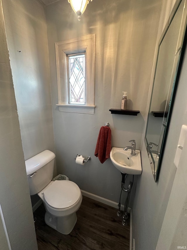 1700 W Taylor St, Kokomo, IN 46901 - half bath with wood finished floors, toilet, baseboards, and a sink