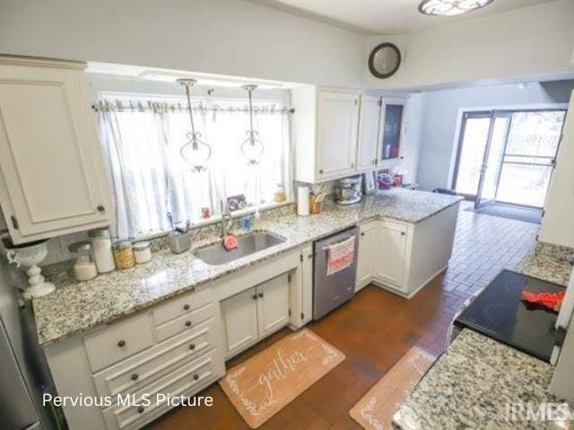 1700 W Taylor St, Kokomo, IN 46901 - kitchen with stainless steel dishwasher, a sink, a peninsula, range with electric stovetop, and white cabinets