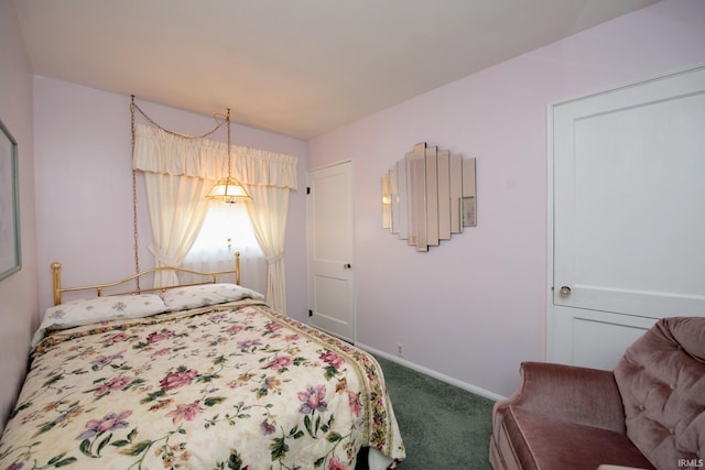 carpeted bedroom with baseboards