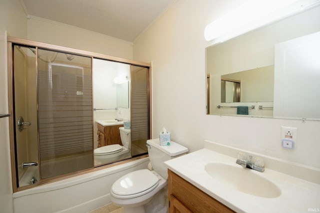 bathroom featuring ornamental molding, vanity, toilet, and enclosed tub / shower combo
