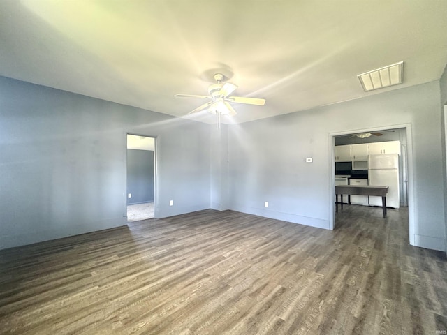 410 NW I St, Linton, IN 47441 - empty room featuring wood finished floors, a ceiling fan, and baseboards
