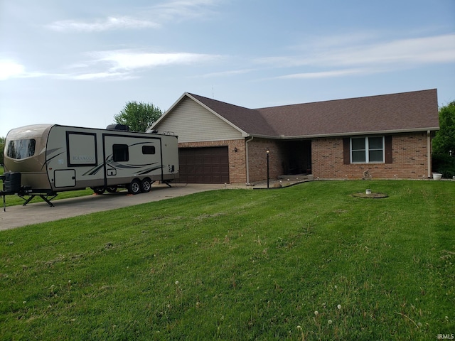 ranch-style home featuring an attached garage, a front yard, concrete driveway, and brick siding
