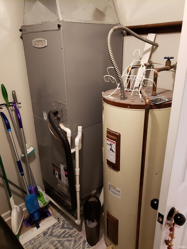utility room with electric water heater