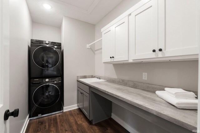18015 Tullymore Ln, Leo, IN 46765 - washroom with cabinet space, stacked washing machine and dryer, dark wood finished floors, baseboards, and recessed lighting