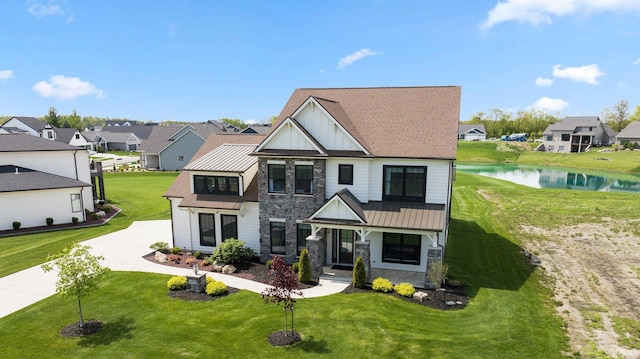18015 Tullymore Ln, Leo, IN 46765 - view of front of house featuring stone siding, a residential view, a water view, and a standing seam roof
