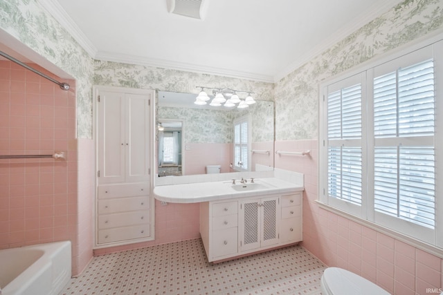 1327 E Wayne St, South Bend, IN 46615 - full bathroom with tile walls, toilet, tile patterned floors, wallpapered walls, and a wainscoted wall