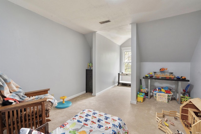 bedroom with lofted ceiling, carpet flooring, and baseboards