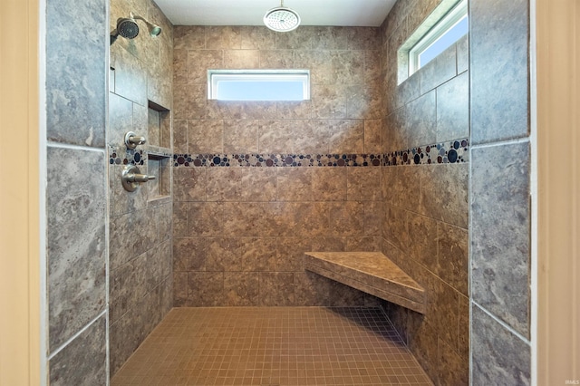 full bath with tiled shower