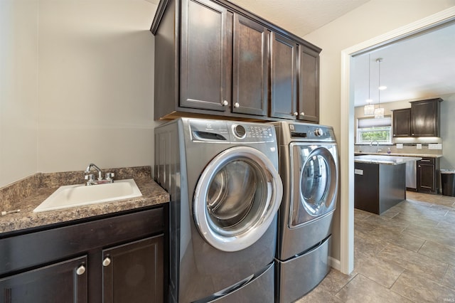 laundry area featuring washer and dryer and cabinet space
