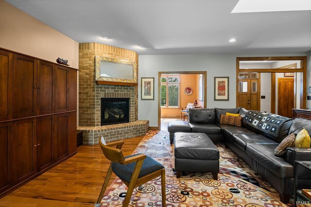 3622 Glenridge Ln, West Lafayette, IN 47906 - living room featuring wood finished floors, recessed lighting, and a brick fireplace