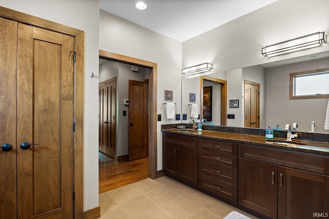 3622 Glenridge Ln, West Lafayette, IN 47906 - full bath with double vanity, tile patterned flooring, and baseboards