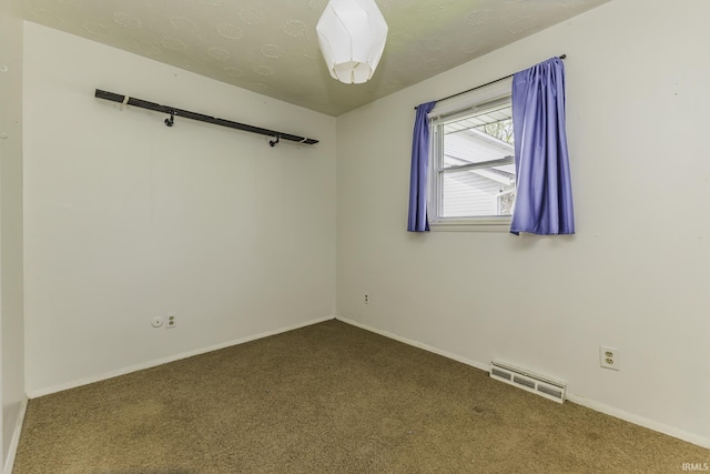 spare room with carpet and baseboards